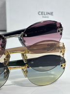 Celine sunglasses with purple-tinted lens and gold metal frame, angled view