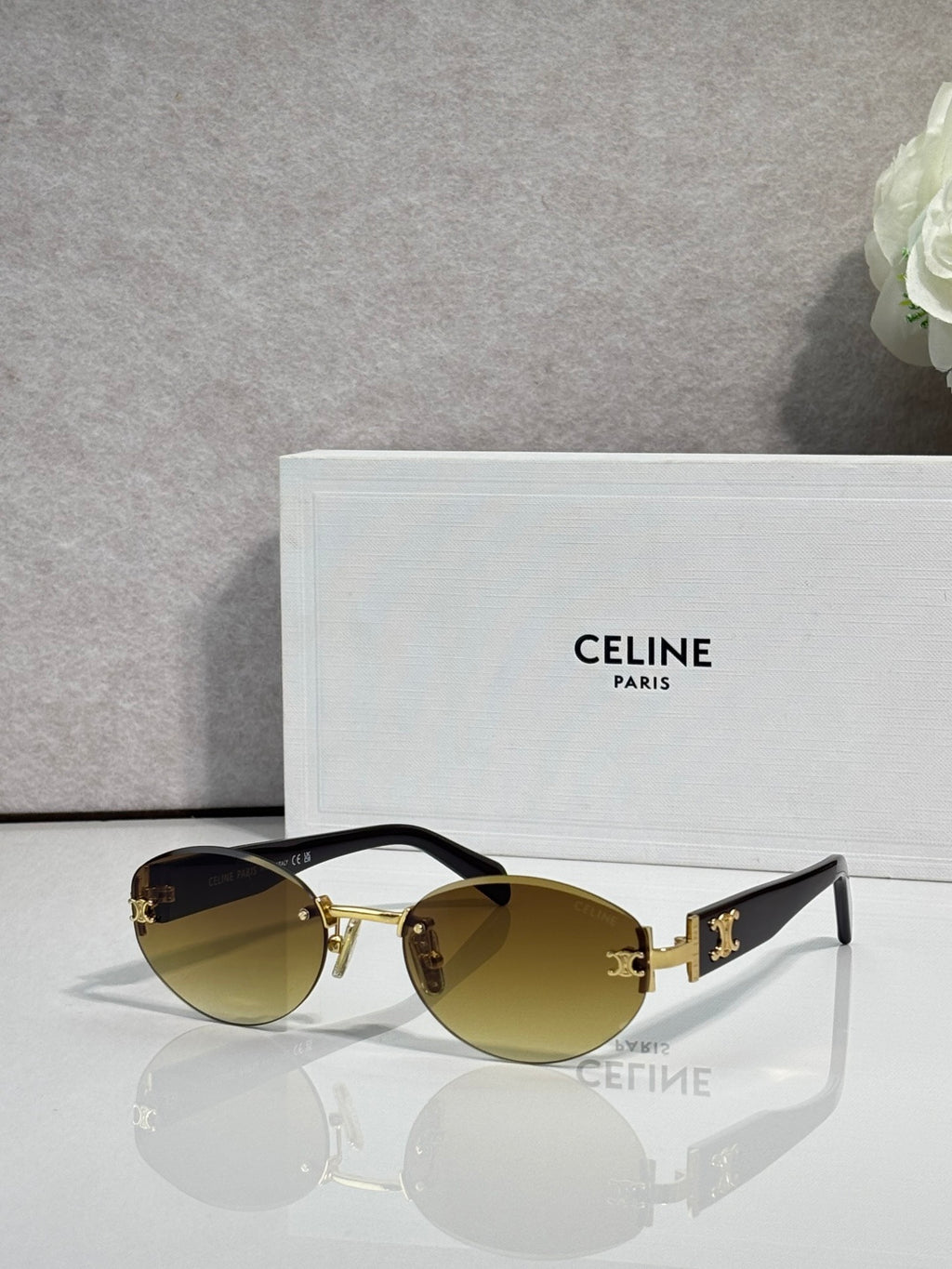 Celine round sunglasses with gold frame and olive-tinted lenses with black accents