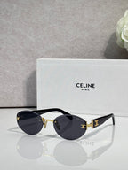 Celine round sunglasses with gold hardware, dark lenses, and black arms