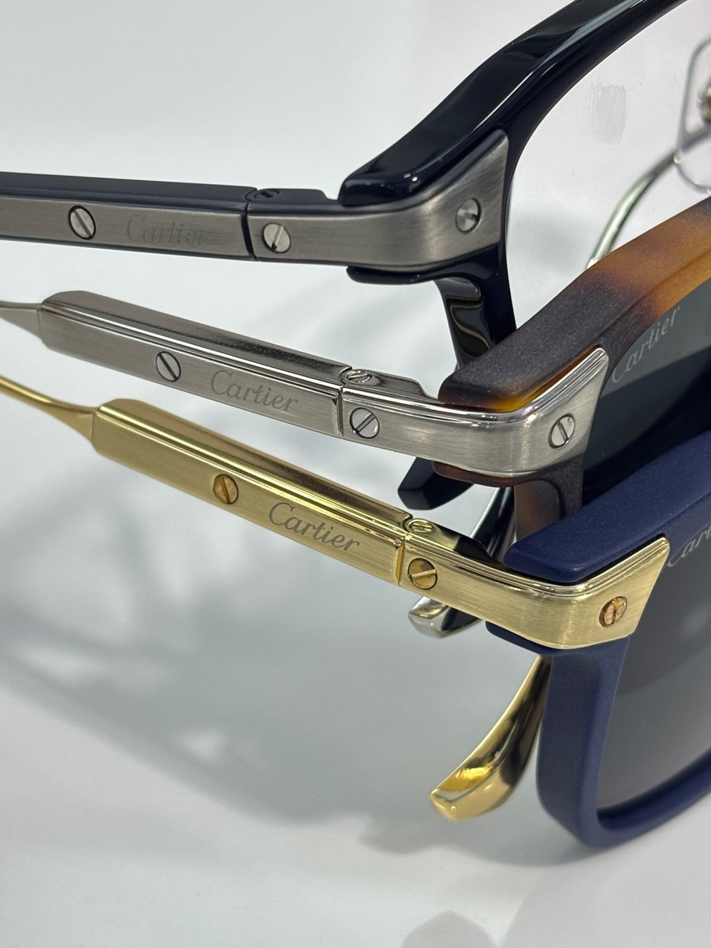 Cartier eyeglasses close-up of gold hinges and printed metal arms