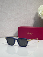 Cartier eyeglasses with navy blue frames and blue tinted lenses