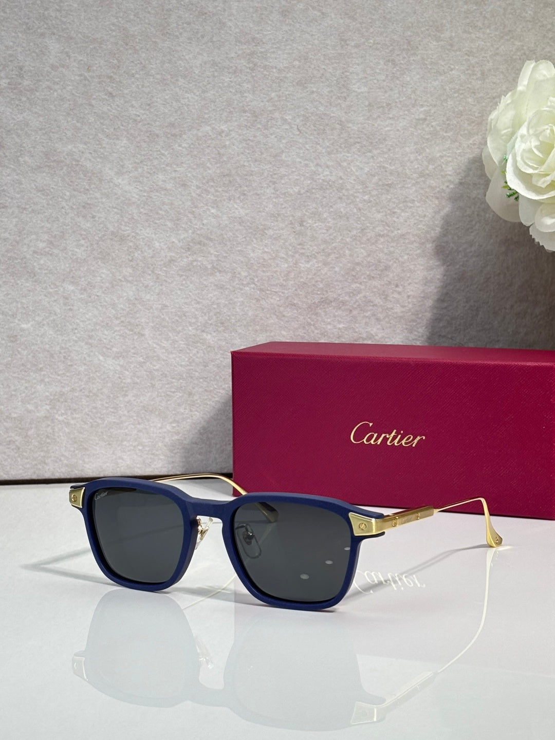 Cartier eyeglasses with navy blue frames and blue tinted lenses