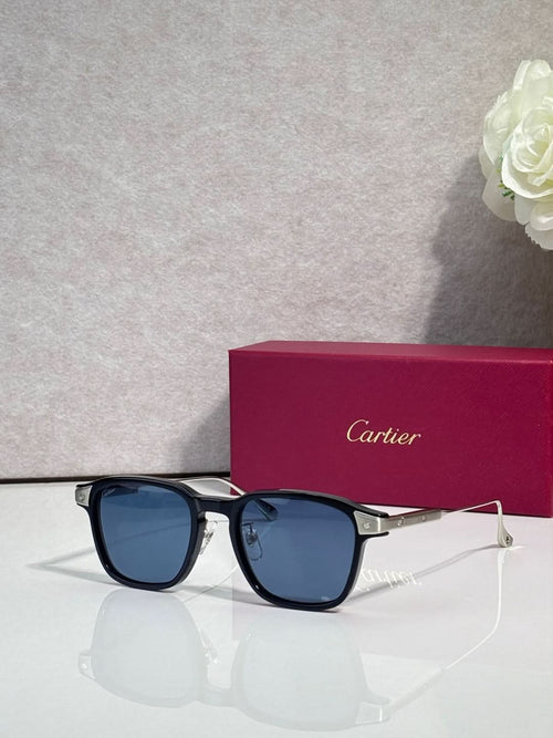 Cartier eyeglasses with black frames and blue tinted lenses