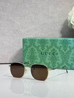 Gold-tone square sunglasses with gradient brown lenses and green temples
