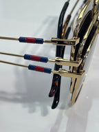 Gucci sunglasses temple arms with gold metal and red/blue enamel details