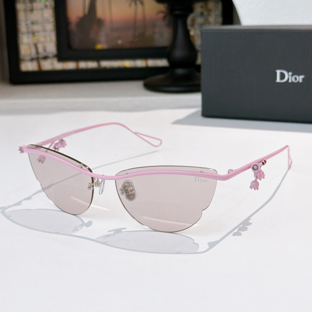 Dior sunglasses with pink frame and light tinted lenses, with floral charm details