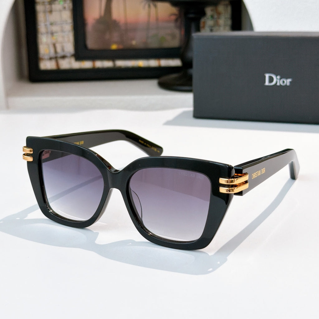 Dior sunglasses with black frames and purple-tinted lenses, gold metal hinges.