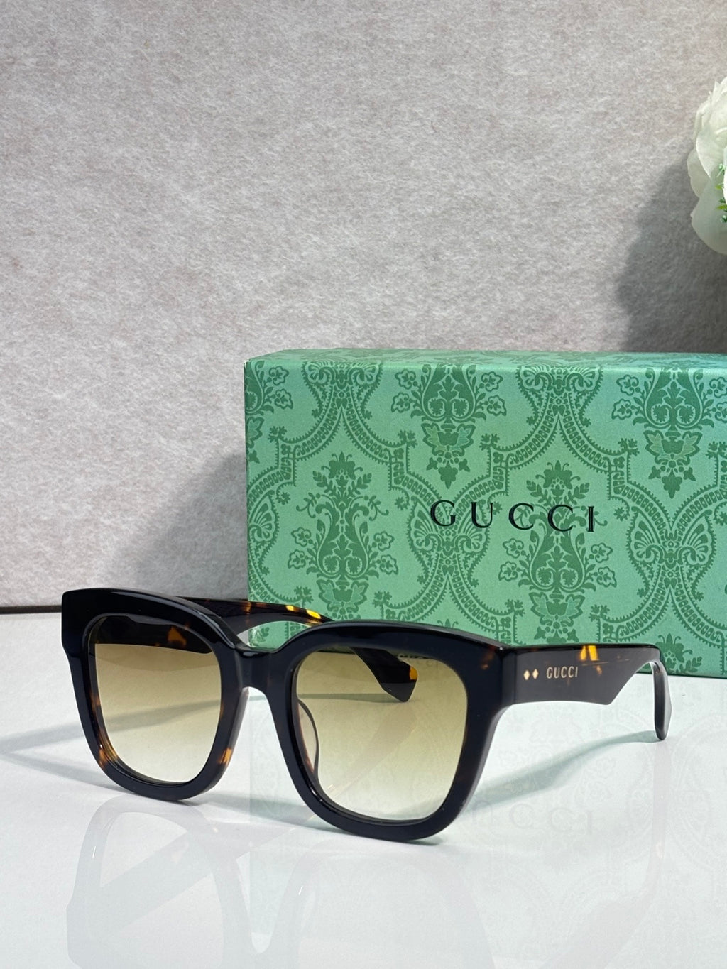 Gucci dark tortoiseshell square sunglasses with pale lenses and black temples
