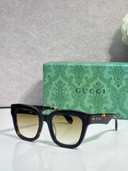Gucci dark tortoiseshell square sunglasses with pale lenses and black temples