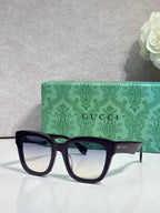 Gucci dark square sunglasses with light-tinted lenses and black temples