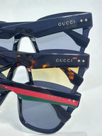 Gucci sunglasses temple arms with Gucci logo and multicolor stripe accents