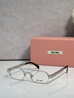 Silver eyeglasses with clear lenses and black temple arms, metal frame with small logo plate