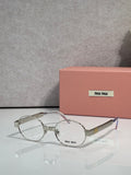 Round metal eyeglass frames with clear lenses, silver-toned arms, Miu Miu logo.