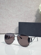Dior sunglasses with dark tinted lenses and silver-tone metal frames