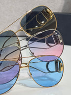 Dior sunglasses set with blue, purple, and dark tinted lenses, gold-tone frames