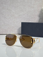 Dior sunglasses with amber tinted lenses and gold-tone metal frames