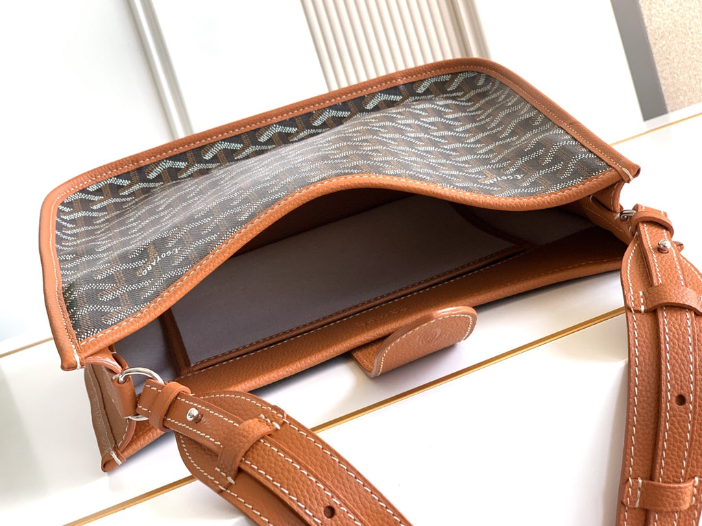 Handbag interior with canvas lining and tan leather base, open top view