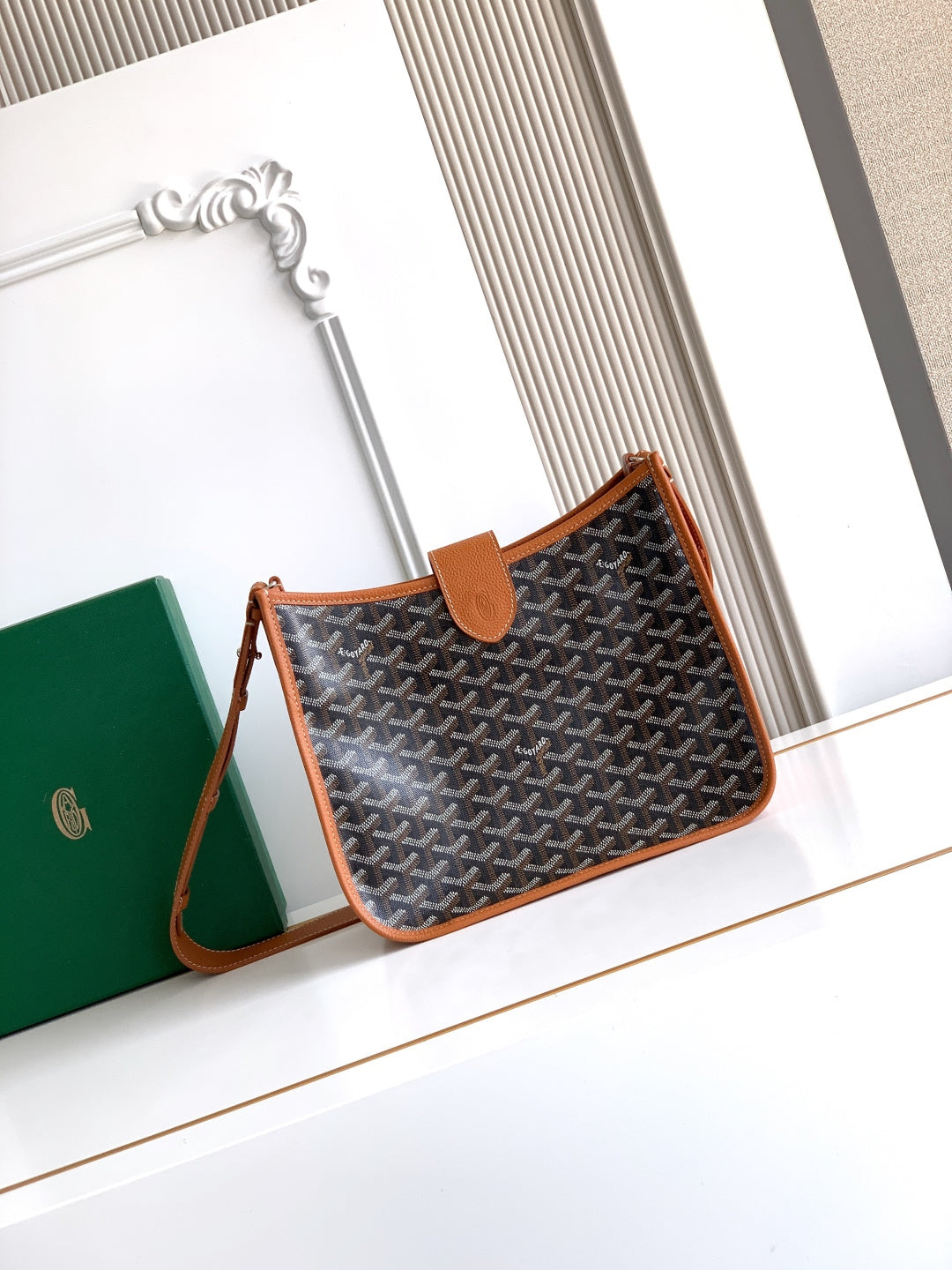 Handbag with monogram canvas and tan leather trim, short shoulder strap