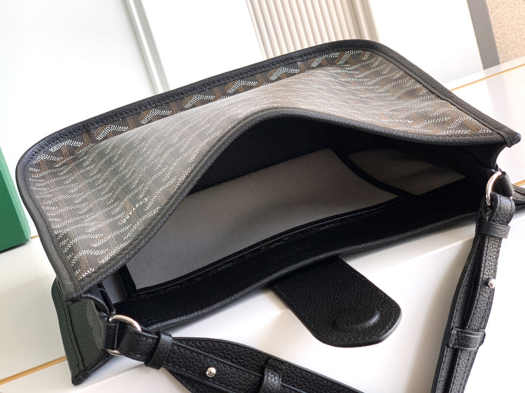 Black shoulder bag with open top, showing lining and inner pocket