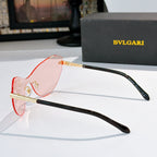 Bvlgari cat-eye sunglasses with black frame and pink-tinted lenses, gold details