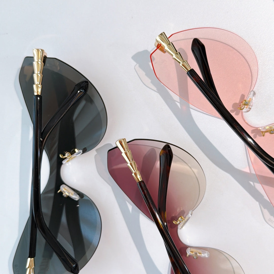 Bvlgari cat-eye sunglasses assortment: black-lens pair and pink-lens pair, gold hardware