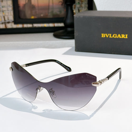 Bvlgari cat-eye sunglasses with dark frame and purple-tinted lenses, gold accents