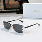Dior sunglasses with black frame, dark lenses, white floral temple details.