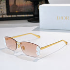 Dior sunglasses with gold frame, pink lenses, white floral temple details.