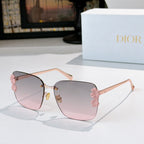 Dior sunglasses with gold frame and pink gradient lenses, pink floral temple accents.