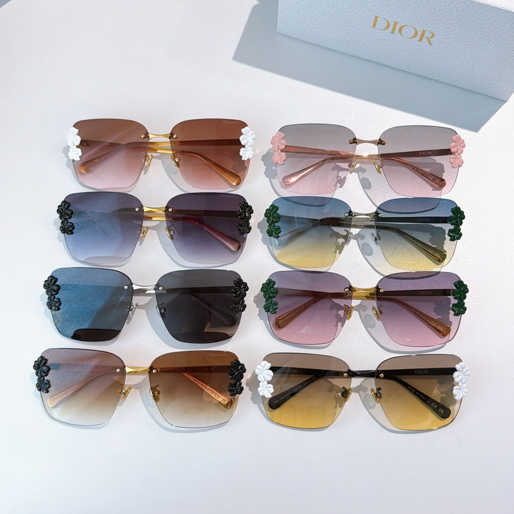 Set of Dior sunglasses with floral temple accents, mixed frames and lens colors.