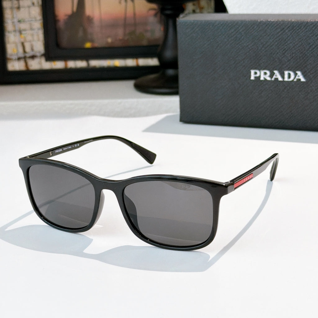 Prada black sunglasses with dark gray lenses and thick squared frames