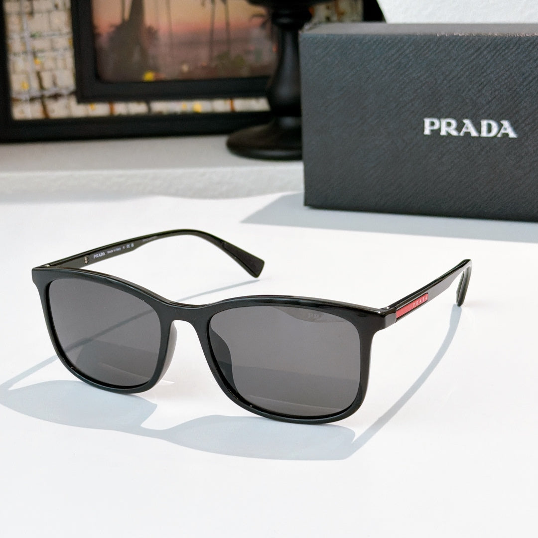 Prada black sunglasses with dark gray lenses and thick squared frames