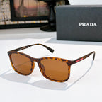 Prada tortoiseshell sunglasses with amber-brown lenses and full-frame shape
