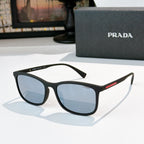 Prada black sunglasses with blue-tinted lenses and angular full-frame silhouette