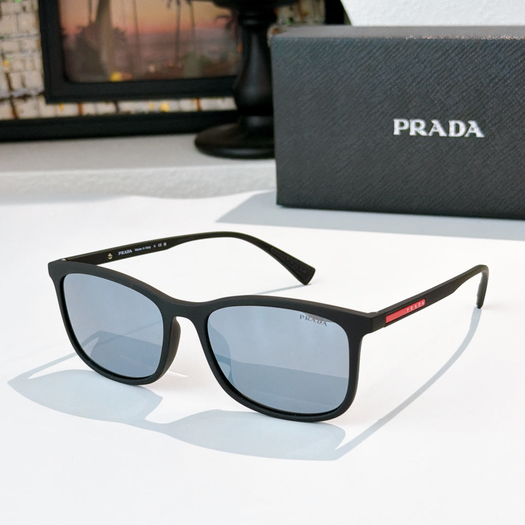 Prada black sunglasses with blue-tinted lenses and angular full-frame silhouette