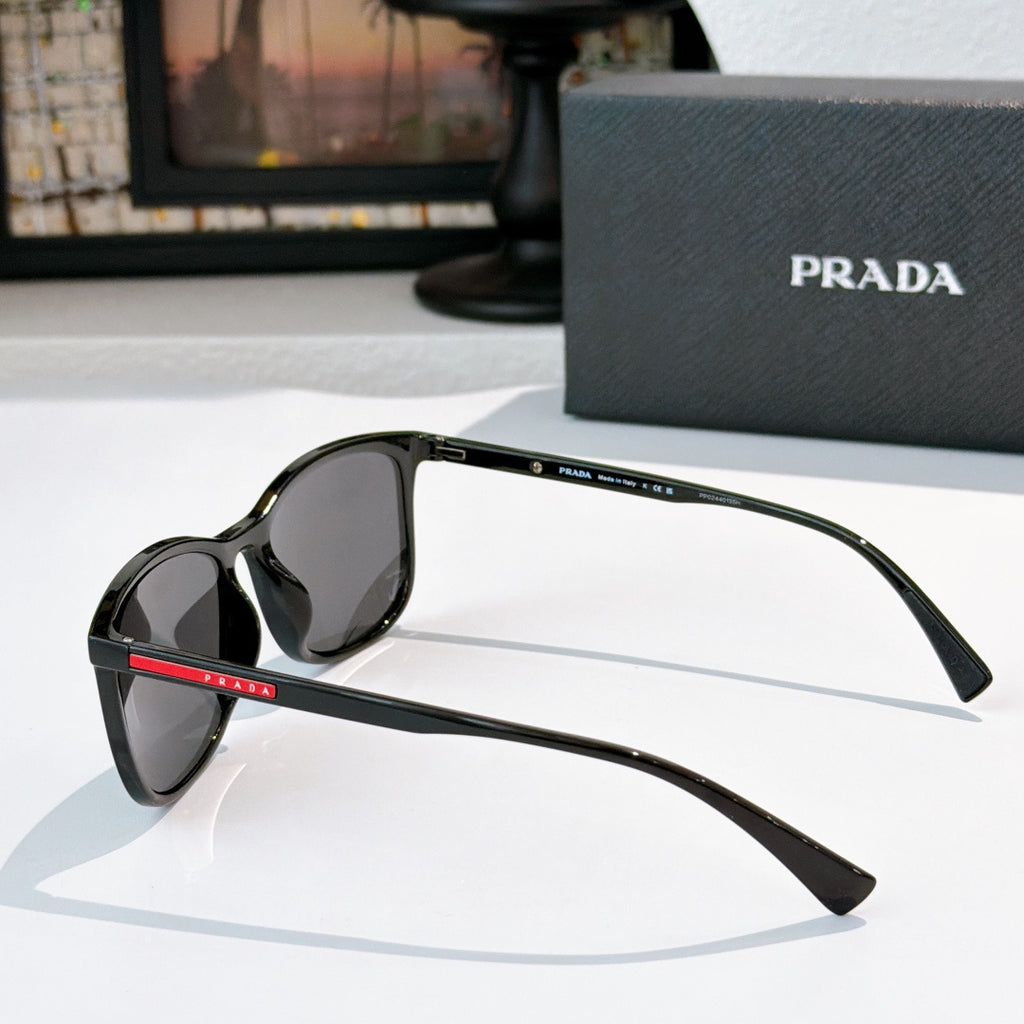 Prada black sunglasses side view with oversized lenses and curved temples