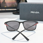Prada black sunglasses front view with mirrored dark lenses and sporty frame