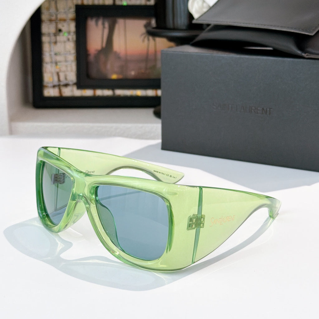 YSL sunglasses with light green frame and blue-tinted lenses
