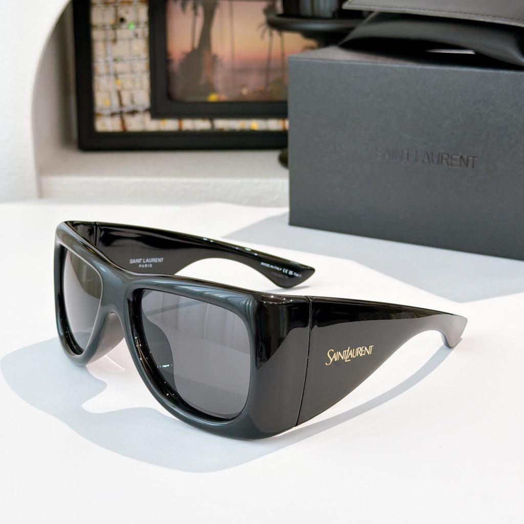 YSL sunglasses with black frame and gray-tinted lenses