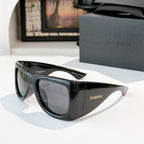 YSL sunglasses with black frame and gray-tinted lenses