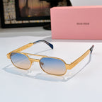 Sunglasses with gold frame, blue-tinted lenses, and dark blue temple tips.