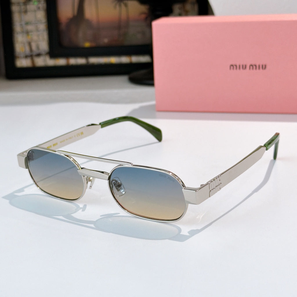 Sunglasses with silver frame, light blue lenses, and green temple tips.