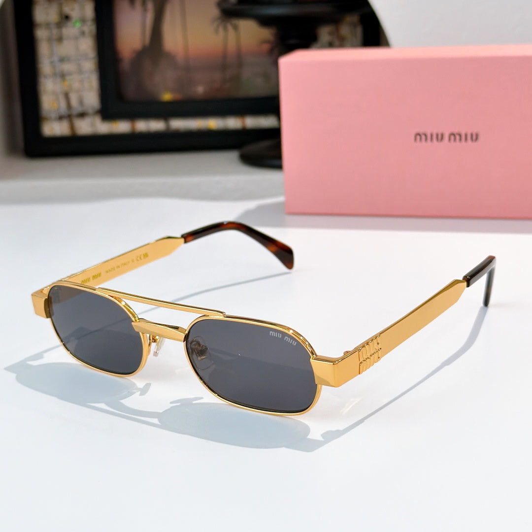 MiuMiu sunglasses with gold frame and dark oval lenses, tortoise temples.
