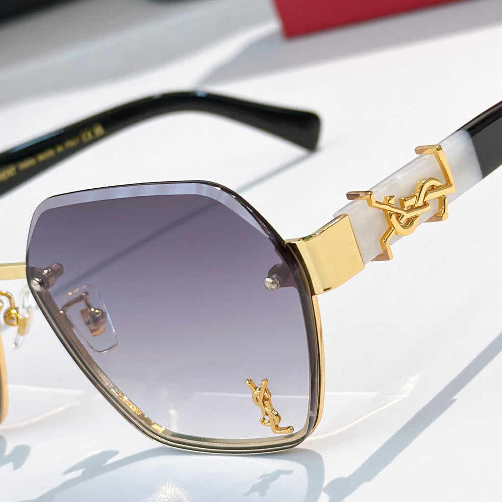 Close-up of gold-tone square sunglasses with purple lenses and branded temple detail