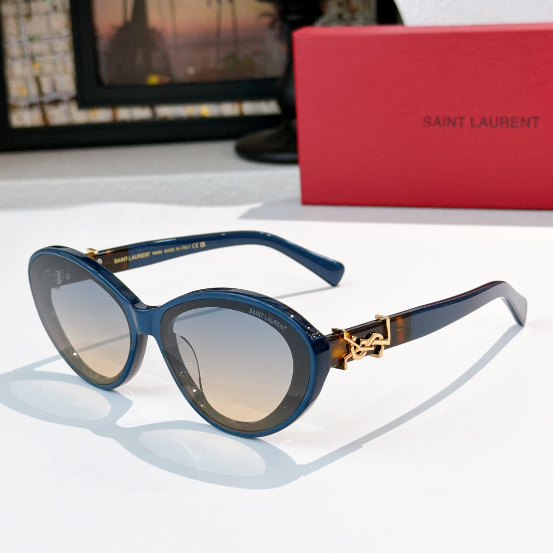 Blue oval sunglasses with gold Saint Laurent logo bridge and tinted lenses