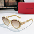 Cream oval sunglasses with gold Saint Laurent logo bridge and tinted lenses