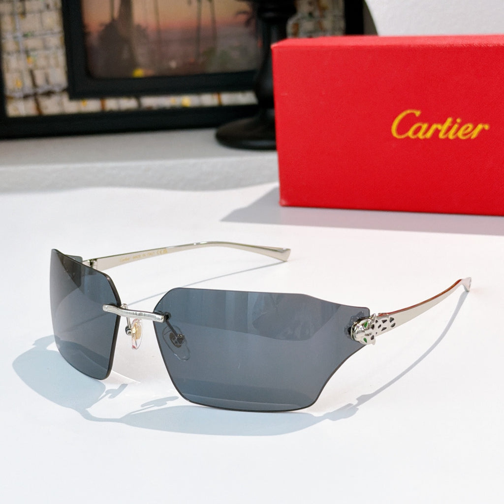 Cartier sunglasses with blue-gray lenses and gold-tone frame, leopard-style temple accent