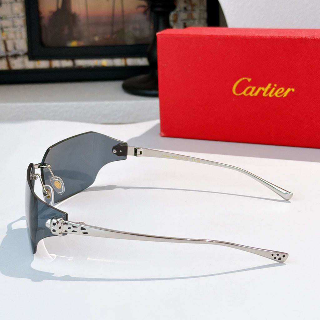 Cartier sunglasses with dark lenses and gold-tone frame, silver hinge and geometric temples