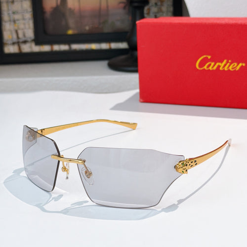 Cartier sunglasses with clear lenses and gold-tone frame, geometric side details
