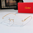 Gold-rimmed cat-eye sunglasses with light blue-tinted lenses